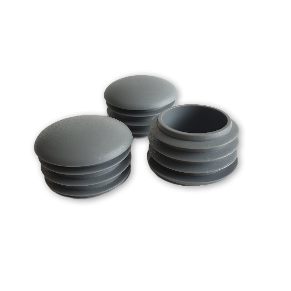 Įkalamas kamštelis apvalus lęšio formos.