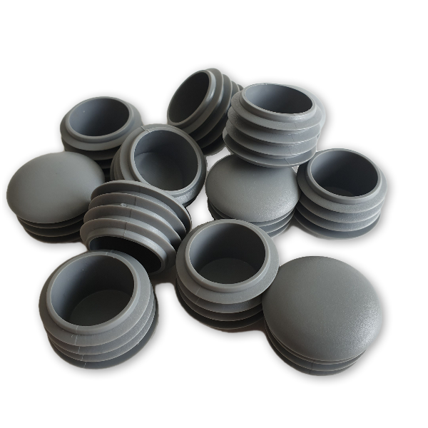 Įkalamas kamštelis apvalus lęšio formos.